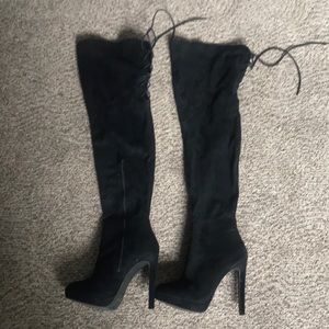 Thigh high heeled boots